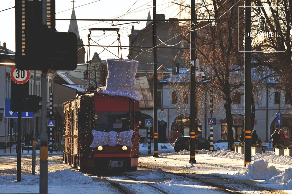 Christmas tram with top hat and bow tie on a sunny winter day