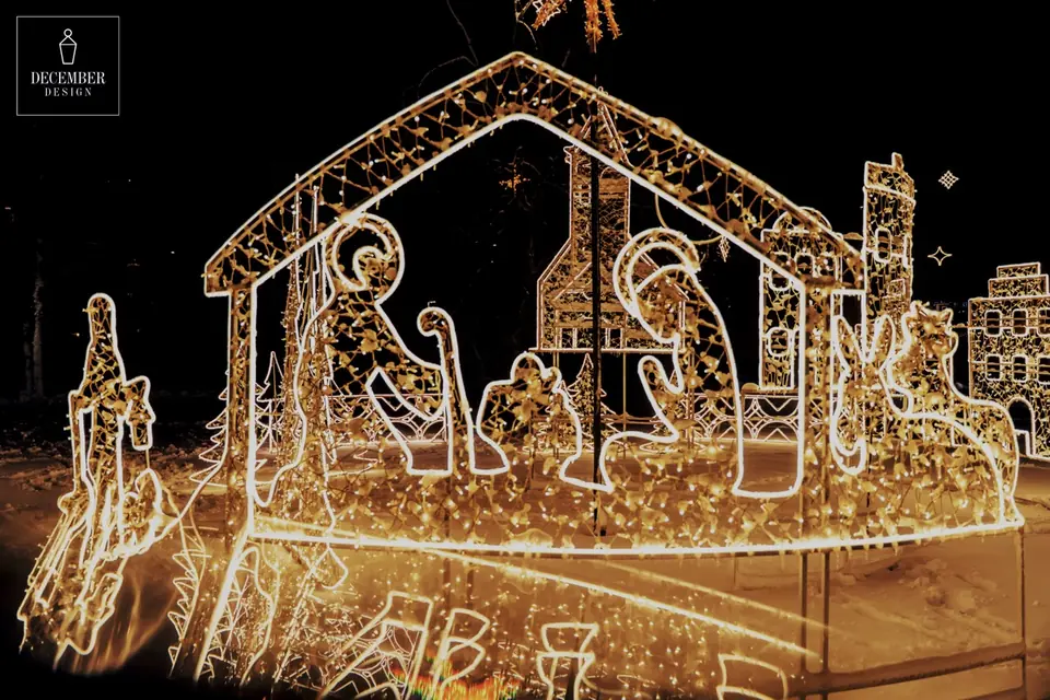 Illuminated composition of Bethlehem manger with figures at night