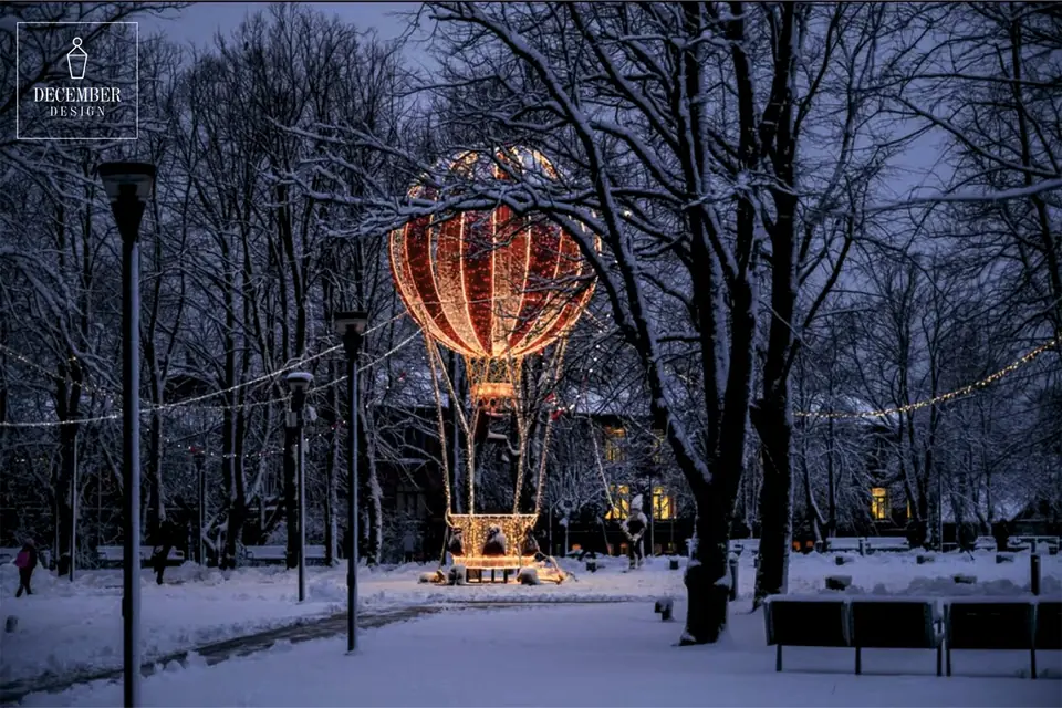Light balloon in a snowy park at dusk, white snow on the trees