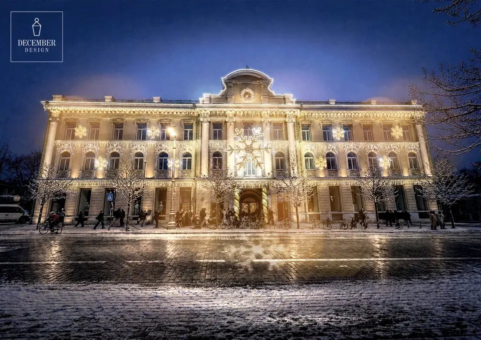 Historic building with large illuminated snowflake and facade light decorations
