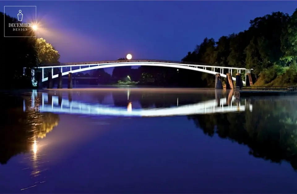 Ogre arched bridge in white light with reflection in water