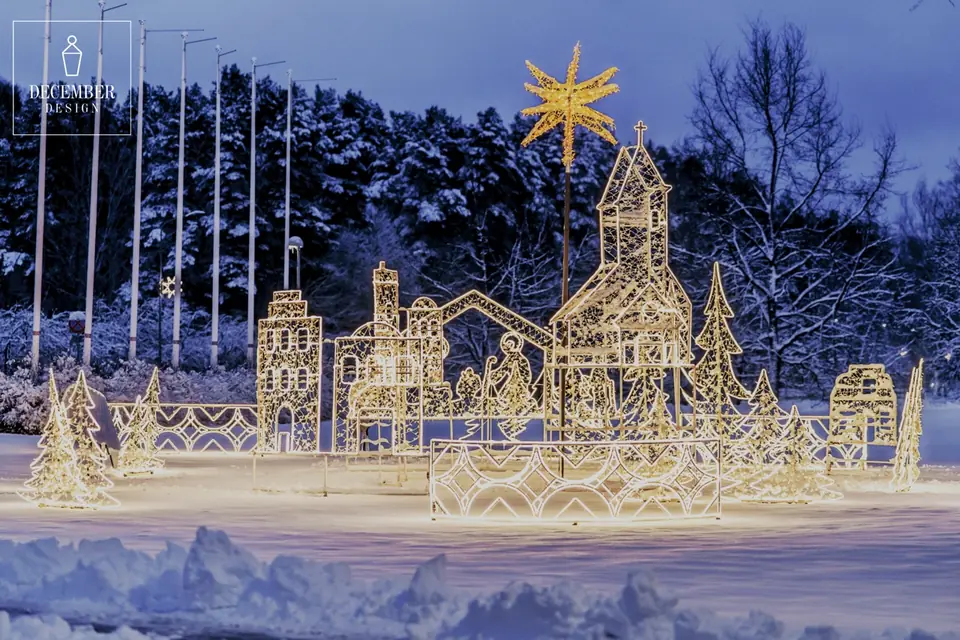 Illuminated light village with church, towers, Christmas trees and a star in a snowy square