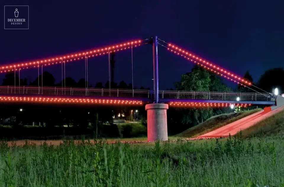 Ogre pedestrian bridge with red contour light at night