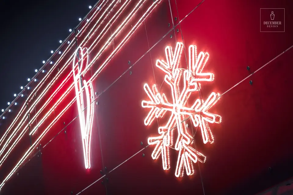 Tilžė shopping centre light snowflake close-up on the red facade panels