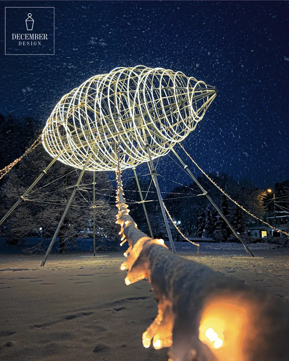 Light airship in snowfall, snowy string of lights in foreground